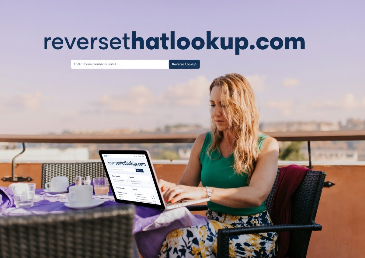 What Is Phishing? 2 A woman working on a laptop on a balcony with a cityscape in the background.
