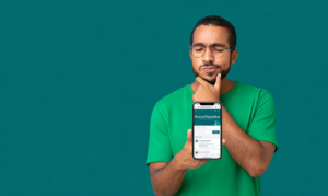 Man holding a smartphone, illustrating people search sites.