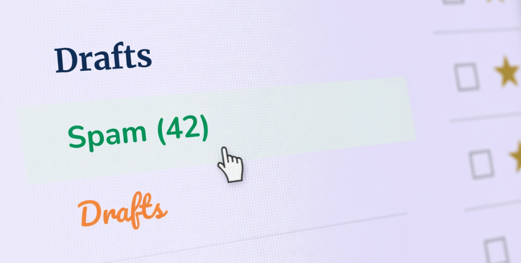 Cursor points at Spam in an email folder, illustrating how to stop spam emails.