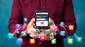 Person holding a smartphone with floating app icons, illustrating how to delete digital footprint.
